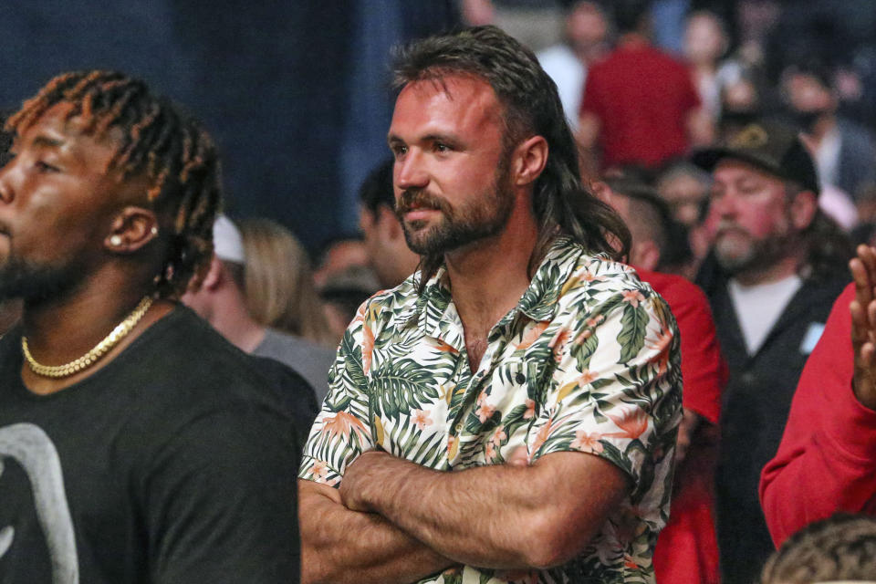 Jacksonville Jaguars quarterback Gardner Minshew watches a UFC 261 mixed martial arts bout, Saturday, April 24, 2021, in Jacksonville, Fla. It is the first UFC event since the onset of the COVID-19 pandemic to feature a full crowd in attendance. (AP Photo/Gary McCullough)