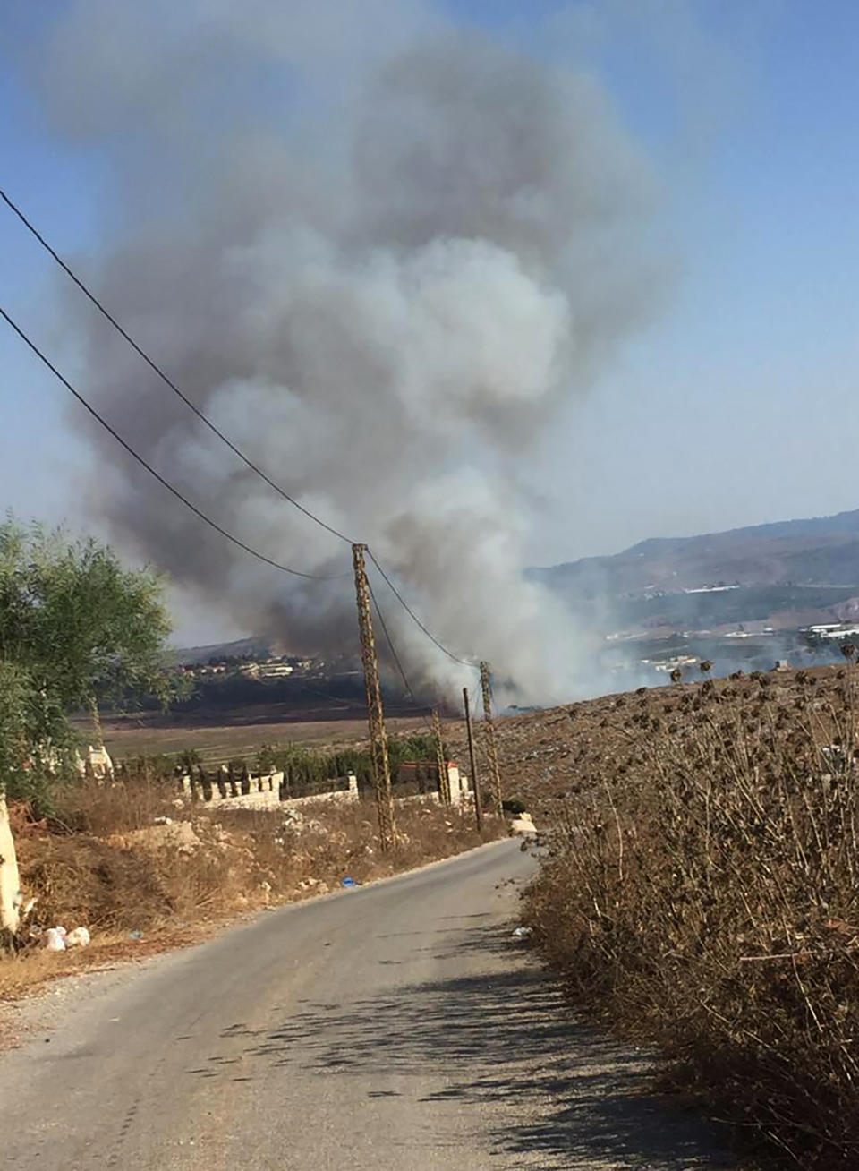 Smoke rises from Israeli army shells that landed in the southern Lebanese border village of Maroun Al-Ras, Lebanon, Sunday, Sept. 1, 2019. The Lebanese army says Israeli forces have fired some 40 shells on the outskirts of several border villages following an attack by the militant Hezbollah group on Israeli troops. (AP Photo)