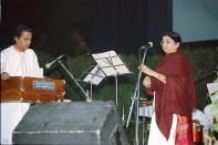 <p>Lata Mangeshkar performing at a function. Photo – Getty </p>