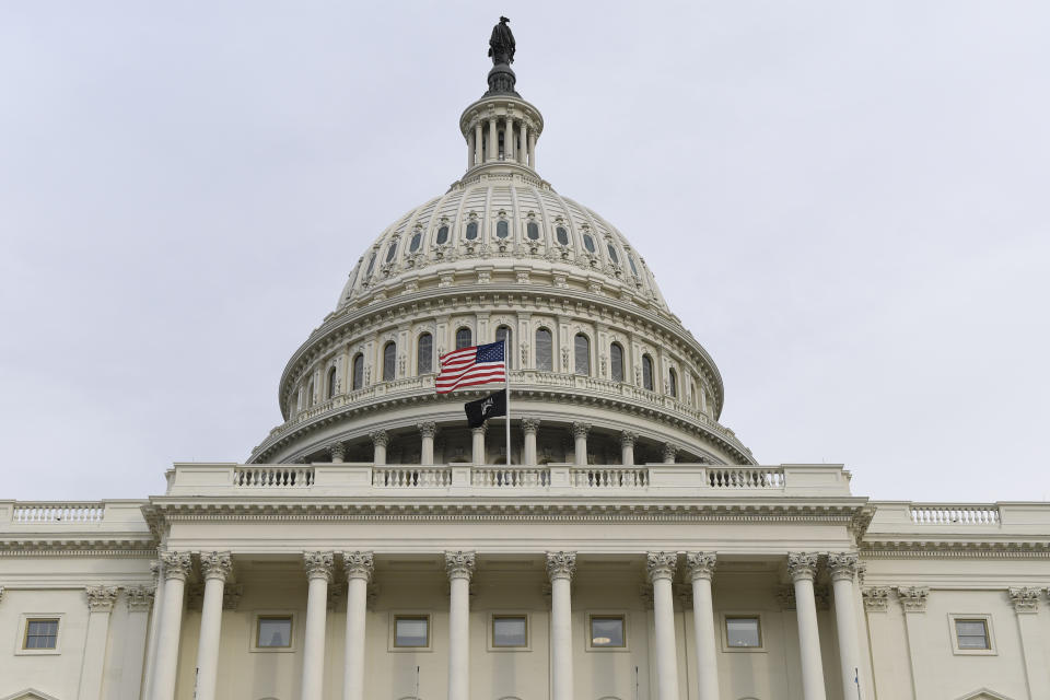 The flag flies outside the U.S. Capitol ahead of President Donald Trump delivering his State of the Union address to a joint session of Congress on Capitol Hill in Washington, Tuesday, Feb. 4, 2020. (AP Photo/Susan Walsh)