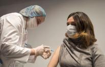 A woman receives an injection with Sputnik V (Gam-COVID-Vac) vaccine against the coronavirus disease (COVID-19) in Moscow