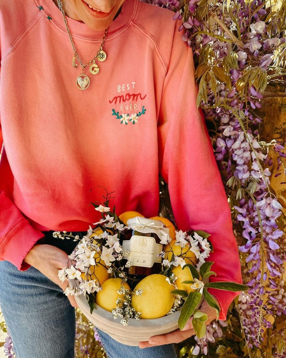 a person holding a basket of flowers