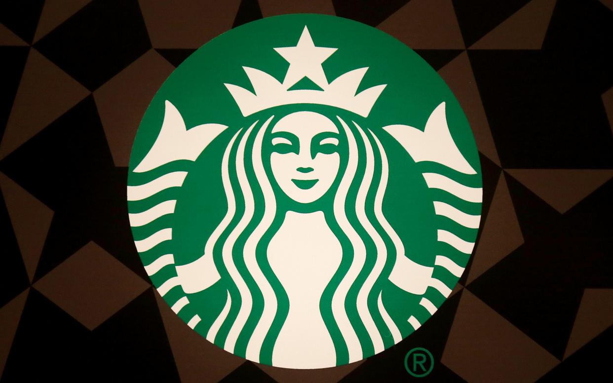 The Starbucks logo - REUTERS/Carlo Allegri