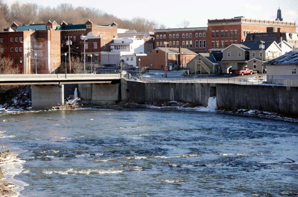 FILE - In this Jan. 21, 2016 file photo, the Hoosic River runs through the village of Hoosick Falls, N.Y. New York Former Gov. Andrew Cuomo has a plan to spend $2 billion to address water contamination and the state's aging, leaky pipes as well as fund efforts to clean up toxic contaminants like the industrial chemical PFOA that tainted the tap water of the upstate village.