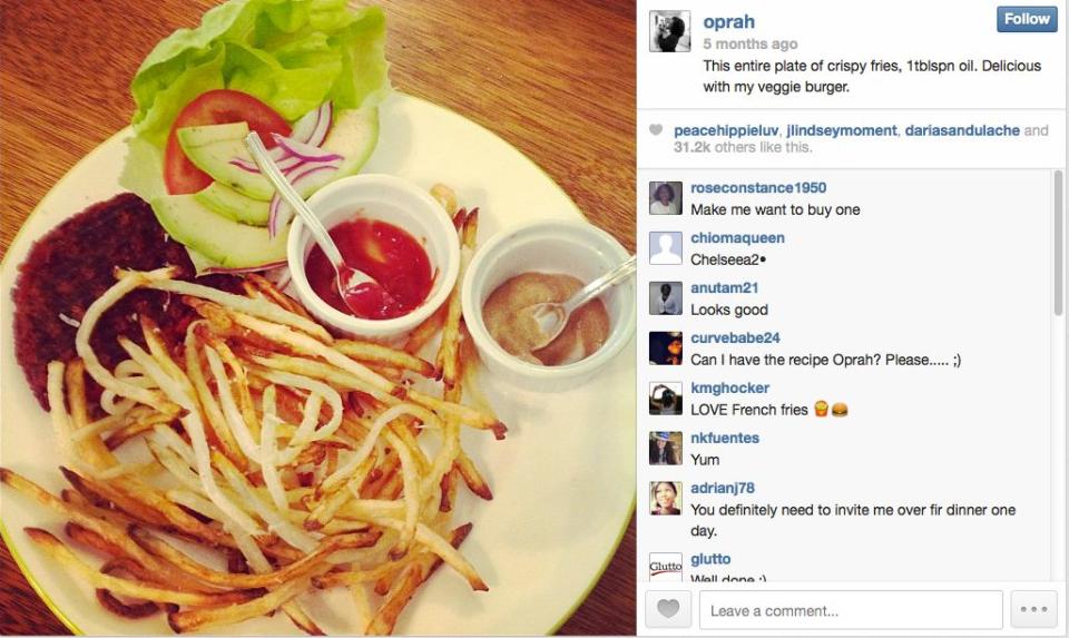 The talk show host digs in to a tasty veggie burger and fries. 