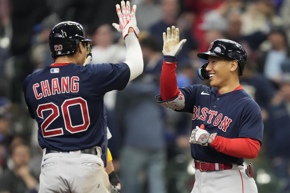 MILWAUKEE, WISCONSIN - APRIL 23: Masataka Yoshida #7 of the Boston Red Sox celebrates with Yu Chang #20 after hitting a grand slam in the eighth inning against the Milwaukee Brewers at American Family Field on April 23, 2023 in Milwaukee, Wisconsin. (Photo by Patrick McDermott/Getty Images)