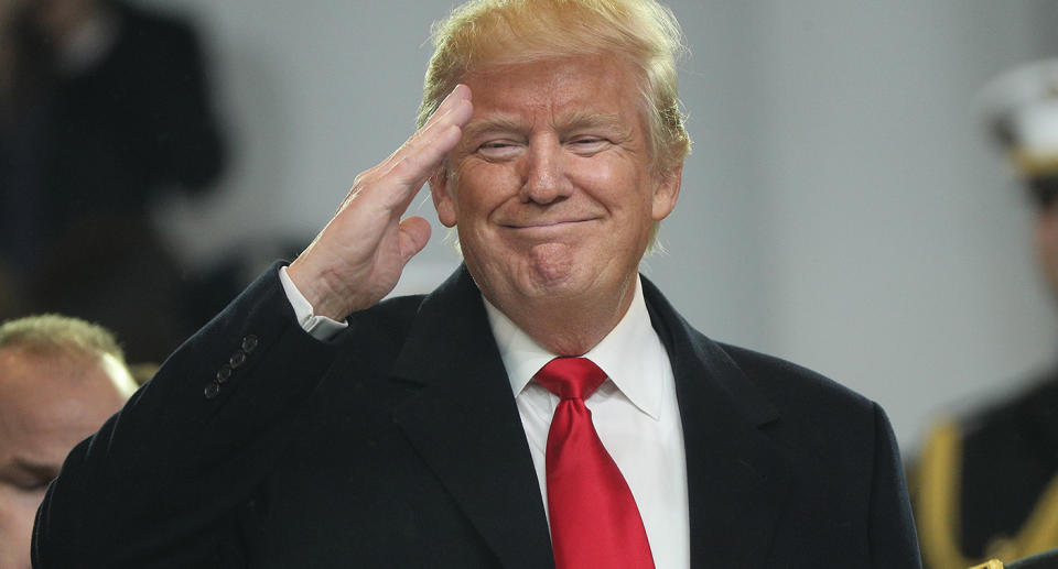  US President Donald J. Trump salutes from the reviewing stand during the Inaugural Parade after he was sworn in as the 45th President of the United States in Washington, DC, USA, 20 January 2017.