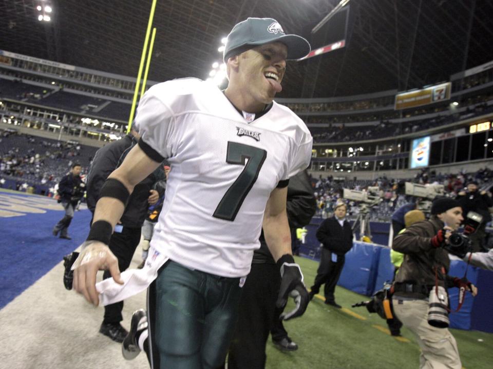 Philadelphia Eagles quarterback Jeff Garcia sticks out his tongue as he runs off the field.