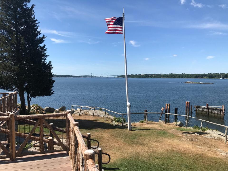 The view across Church Cove from Cove Cabin at Mount Hope Farm includes the Mount Hope Bridge in the distance and Seal Island, in the foreground on the right.