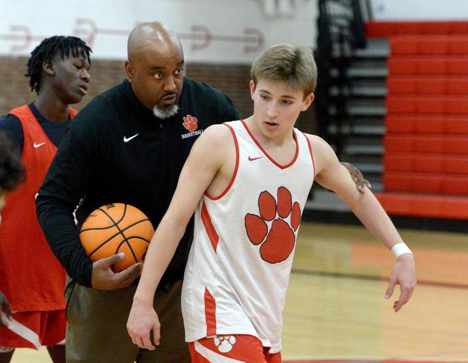 South Meck Head Coach Chris McDonald (left) directs #5 Will Rothacker, a senior as McDonald led the team through practice Wednesday, Jan. 3, 2024.The South Meck Sabres are 13-0 this season They face off against, 4A power, Richmond, on Saturday.