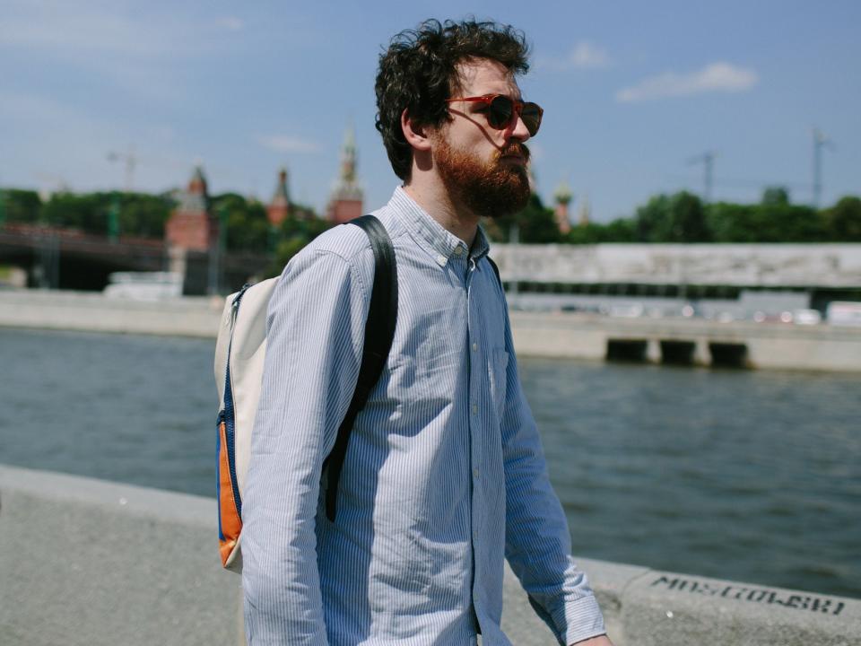 man walking thinking pensive sunglasses