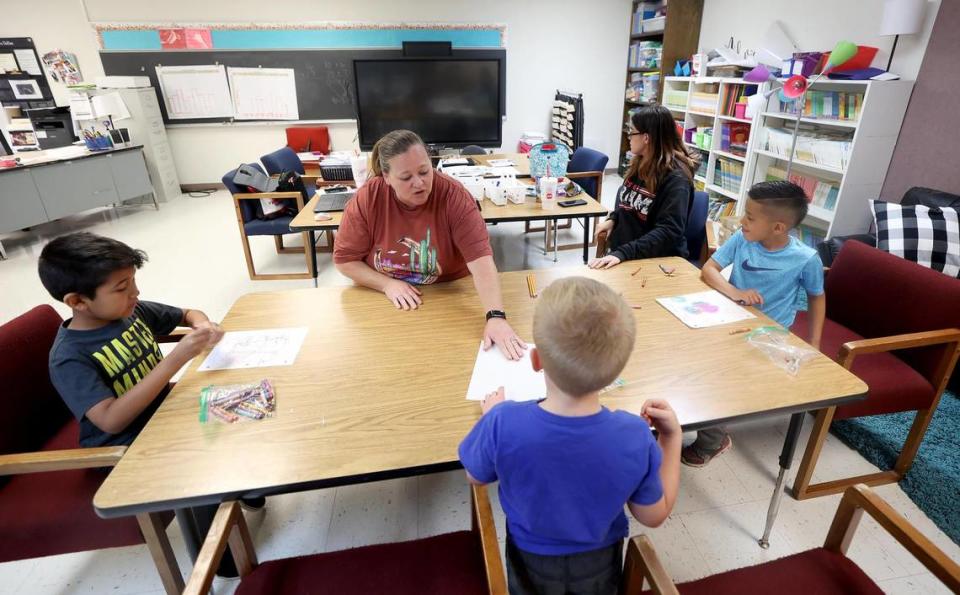 Teacher Melissa Lockhart, center, and paraprofessional Amber Spratlin, right, lead students Hayden Bolanos, Whitten Doyle and Diego Nava in instruction during a Friday catch-up program at Houston Elementary in Mineral Wells on April 14, 2023.