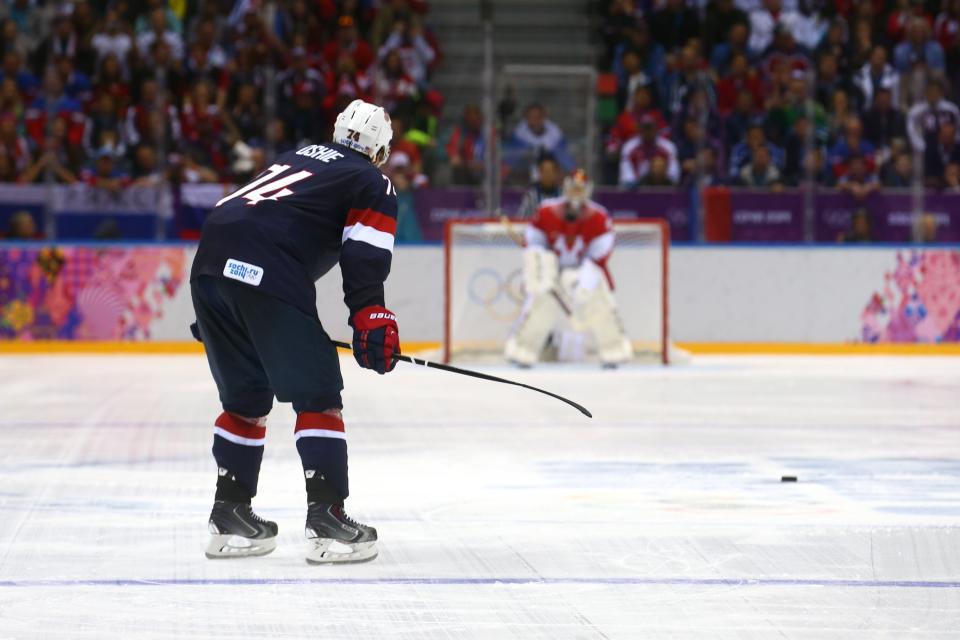 SOCHI, RUSSIA - FEBRUARY 15: T.J. Oshie #74 of the United States scores on a shootout against Sergei Bobrovski #72 of Russia during the Men&#39;s Ice Hockey Preliminary Round Group A game on day eight of the Sochi 2014 Winter Olympics at Bolshoy Ice Dome on February 15, 2014 in Sochi, Russia. (Photo by Streeter Lecka/Getty Images)