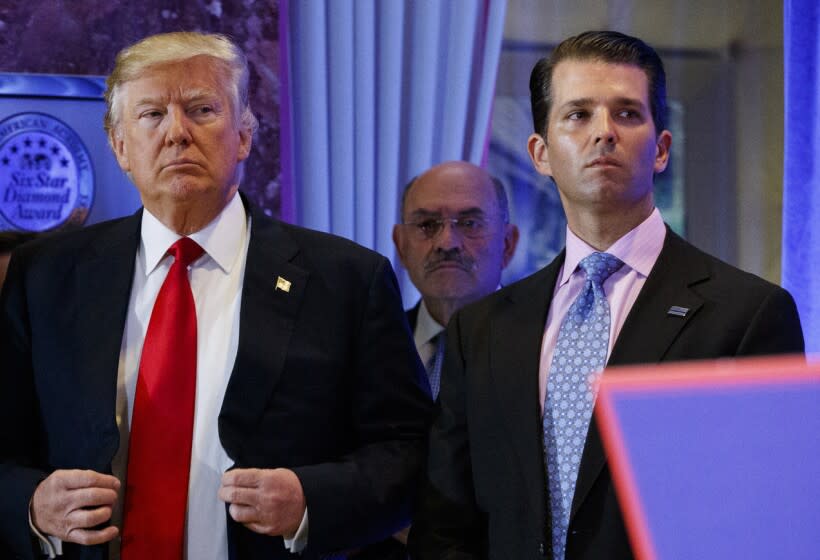 FILE - In this Jan. 11, 2017, shows President-elect Donald Trump, left, his chief financial officer Allen Weisselberg, center, and his son Donald Trump Jr., right, attend a news conference in the lobby of Trump Tower in New York. Manhattan prosecutors have informed Donald Trump's company that it could soon face criminal charges stemming from a long-running investigation into the former president's business dealings. The New York Times reported that charges could be filed against the Trump Organization as early as next week related to fringe benefits the company gave to top executives, such as use of apartments. (AP Photo/Evan Vucci, File)
