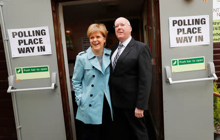 Nicola Sturgeon and her husband Peter Murrell arrive to vote in local elections at a polling station in Glasgow, Scotland, May 4, 2017. REUTERS/Russell Cheyne