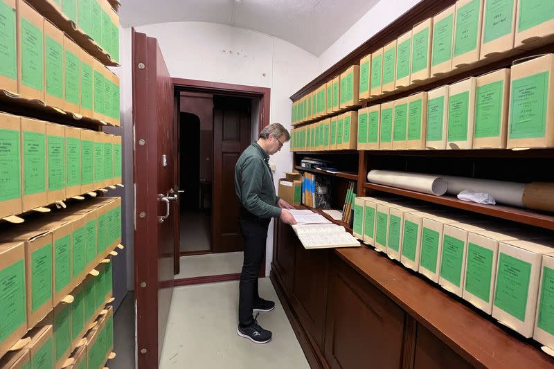 Bjoern Vangen, head librarian at the Norwegian Nobel Institute, reads nominations made to the 1973 Nobel Peace Prize, in the archive room of the Norwegian Nobel Institute in Oslo