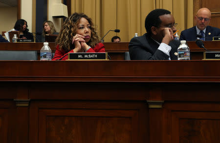 U.S. Reps Lucy McBath (D-GA), left, and Joe Neguse (D-CO) listen as the House Judiciary Committee considers whether to hold U.S. Attorney General William Barr in contempt of Congress for not responding to a subpoena on Capitol Hill in Washington, U.S., May 8, 2019. REUTERS/Leah Millis