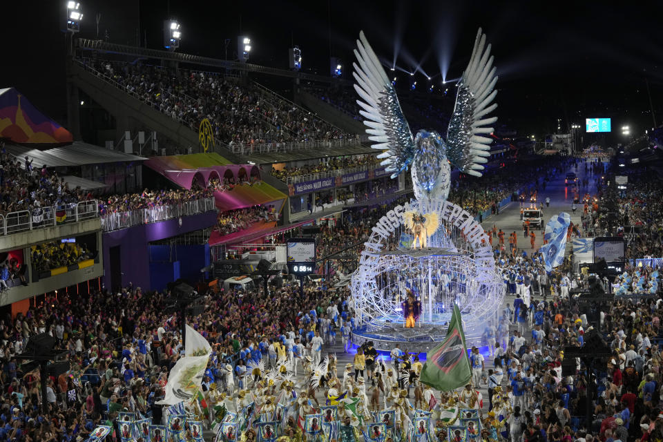 Performers from the Beija Flor samba school parade on a float during Carnival celebrations at the Sambadrome in Rio de Janeiro, Brazil, Tuesday, Feb.21, 2023. (AP Photo/Silvia Izquierdo)