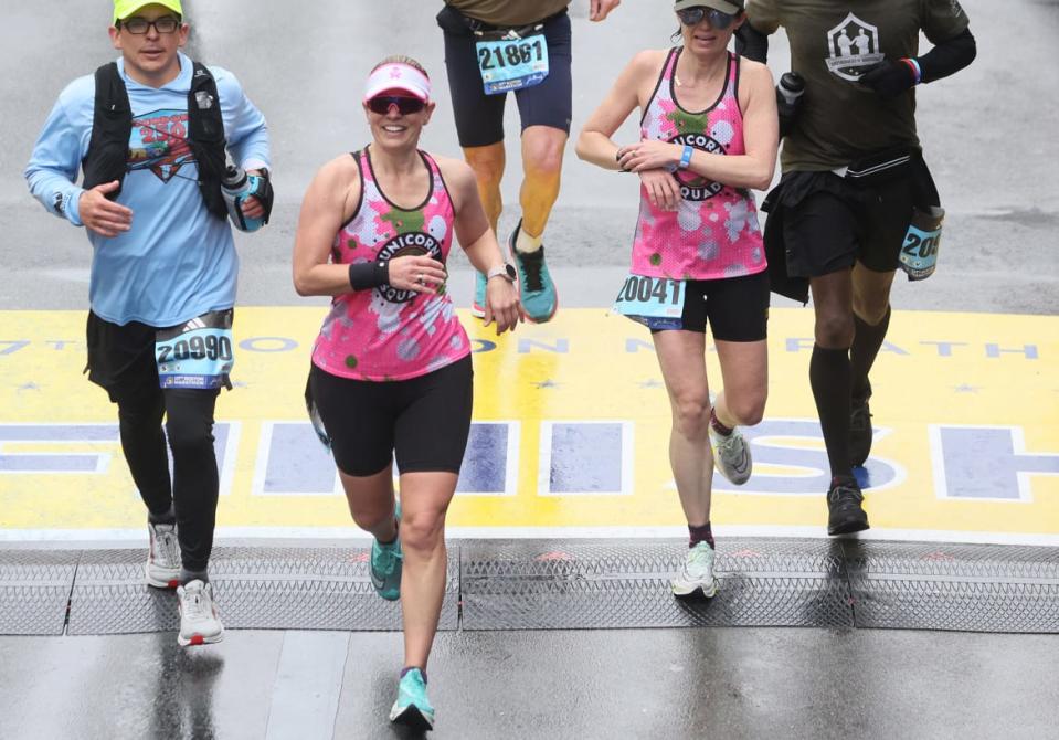 <div class="inline-image__title">1251947816</div> <div class="inline-image__caption"><p>Sen. Kyrsten Sinema, second from left, crosses the finish line of the 127th Boston Marathon. </p></div> <div class="inline-image__credit">Jessica Rinaldi/The Boston Globe via Getty Images</div>