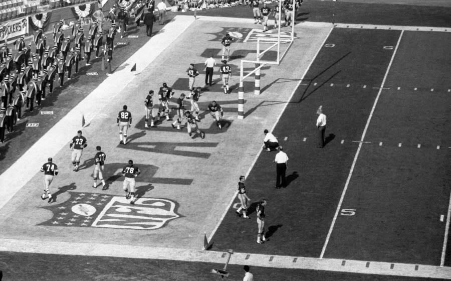 LOS ANGELES, CA – JANUARY 15, 1967: Members of the Green Bay Packers warm up in the end zone prior to Super Bowl I on January 15, 1967 against the Kansas City Chiefs at the Los Angeles Memorial Coliseum in Los Angeles, California. The Packers beat the Chiefs, 35-10 to win the professional football World Championship. 19670115-FR-003 1967 Kidwiler Collection/Diamond Images