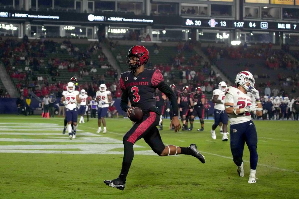 Oct 30, 2021; Carson, California, USA; San Diego State Aztecs quarterback William Haskell (3) scores on a seven yard touchdown run against the Fresno State Bulldogs in the second half at Dignity Health Sports Park. Mandatory Credit: Kirby Lee-USA TODAY Sports