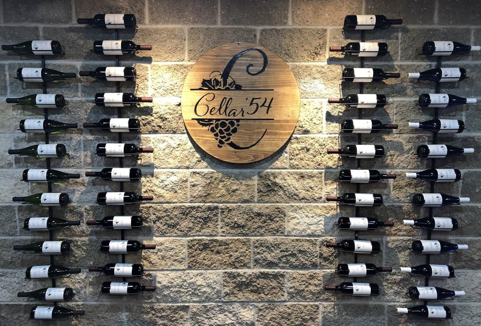 Wine bottles are featured in a soon-to-be finished tasting room, on April 2, 2022, at Cellar '54, 9368 W. Law Road in North East Township. The winery opened in July 2021.