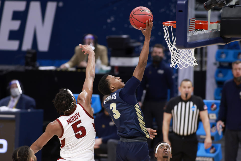 INDIANAPOLIS, INDIANA - MARCH 27: Max Abmas #3 of the Oral Roberts Golden Eagles takes a shot while guarded by Moses Moody #5 of the Arkansas Razorbacks during the second half in the Sweet Sixteen round of the 2021 NCAA Men's Basketball Tournament  at Bankers Life Fieldhouse on March 27, 2021 in Indianapolis, Indiana. (Photo by Justin Casterline/Getty Images)