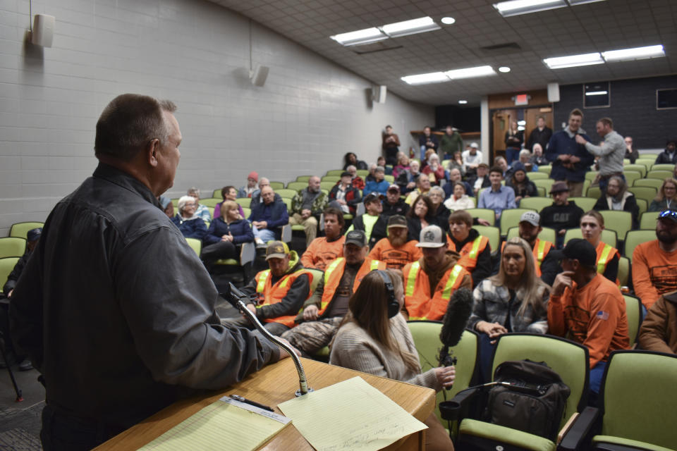 Sen. Jon Tester, D-Mont., listens as a person urges him to call for a ceasefire in Gaza during a town hall hosted by the Democratic lawmaker at Montana Technological University, Nov. 10, 2023, in Butte, Mont. Tester is seeking re-election to a fourth term. (AP Photo/Matthew Brown)