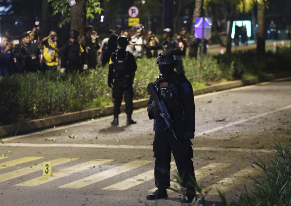 Officers stand guard at the site where an explosion that police said came from a firecracker, near the venue of the presidential candidates debate in Jakarta, Indonesia, Sunday, Feb. 17, 2019. Indonesia is gearing up to hold its presidential election on April 17 that will pit in the incumbent against the former general.(AP Photo / Achmad Ibrahim)