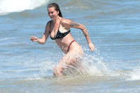 <p>Ireland Baldwin savors a day out at the beach in Malibu with her friends on Friday.</p>