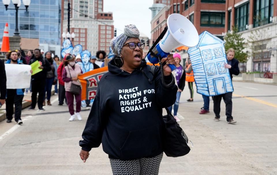 A homeowner association community organizer for Direct Action for Rights & Equality helps lead a protest up Gaspee Street to the State House in 2022. A number of new Rhode Island laws address tenants' rights.
(Credit: Kris Craig/The Providence Journal)