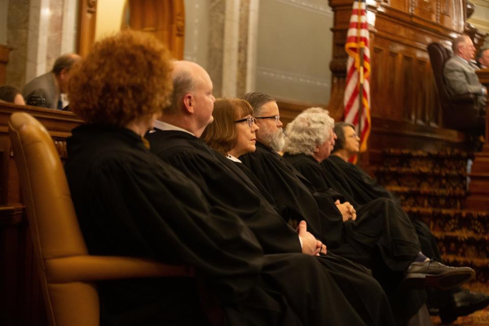 Members of the Kansas Supreme Court listen in to Gov. Laura Kelly's State of the State address Tuesday.