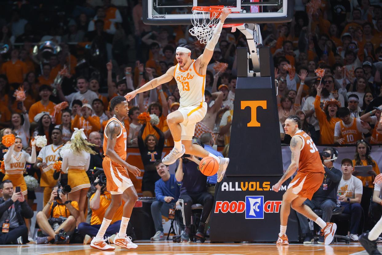 Tennessee forward Olivier Nkamhoua scores on a dunk during the second half of the No. 4 Volunteers' 82-71 win over No. 10 Texas on Saturday. Nkamhoua led the Vols with 27 points as Tennessee improved to 18-3. Texas fell to 17-4.