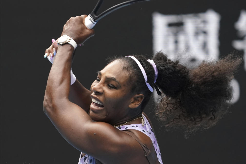 Serena Williams of the U.S. plays a shot to China's Wang Qiang in their third round singles match at the Australian Open tennis championship in Melbourne, Australia, Friday, Jan. 24, 2020. (AP Photo/Lee Jin-man)