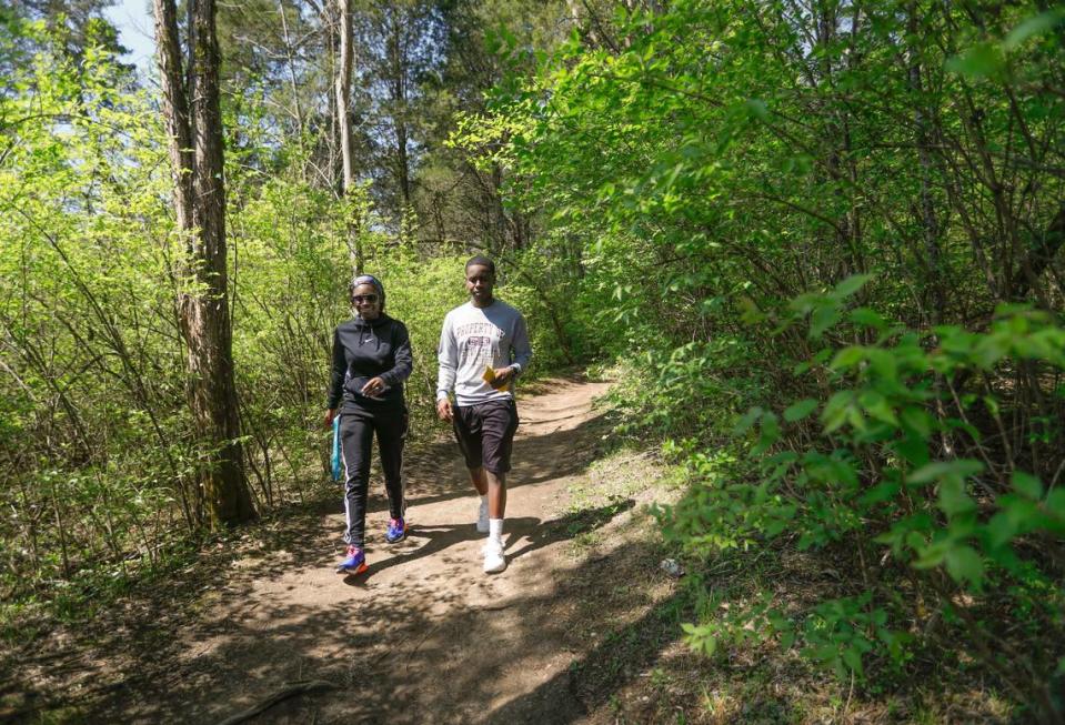 Two hikers explore a trail at Raven Run, a vast nature sanctuary in Lexington, Ky.
