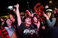 Fans celebrate after the San Francisco Giants defeated the Kansas City Royals to win the World Series during a television viewing event at the Civic Center in San Francisco, California October 29, 2014. REUTERS/Robert Galbraith