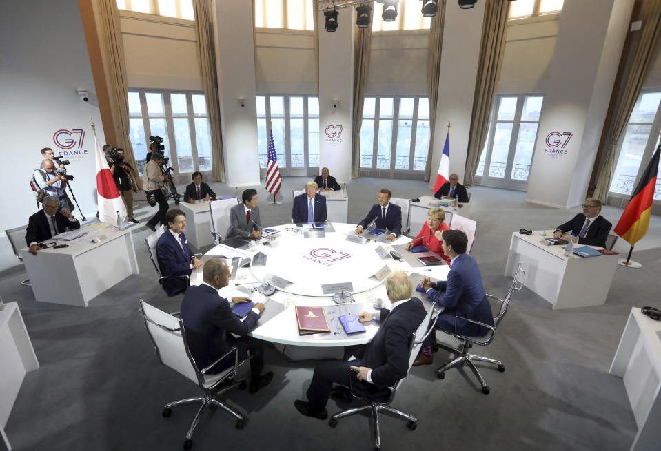 FILE - In this Aug. 25, 2019, file photo world leaders prepare to start a working session on World Economy and Trade on the second day of the G-7 summit in Biarritz, France. They are from clockwork top center: President Donald Trump, French President Emmanuel Macron, German Chancellor Angela Merkel, Canadian Prime Minister Justin Trudeau, Britain's Prime Minister Boris Johnson, President of the European Council Donald Tusk, Italian Premier Giuseppe Conte and Japanese Prime Minister Shinzo Abe. Already on a first-name basis with relationships that range from just months to years, the leaders of the Group of 7 industrialized democracies are gathering Friday amid hopes that the departure of their most unruly member and a new era of personal friendships enhanced by face-to-face discussions can restore a global anti-authoritarian consensus on climate, coronavirus, China and Russia. (AP Photo/Markus Schreiber, File)