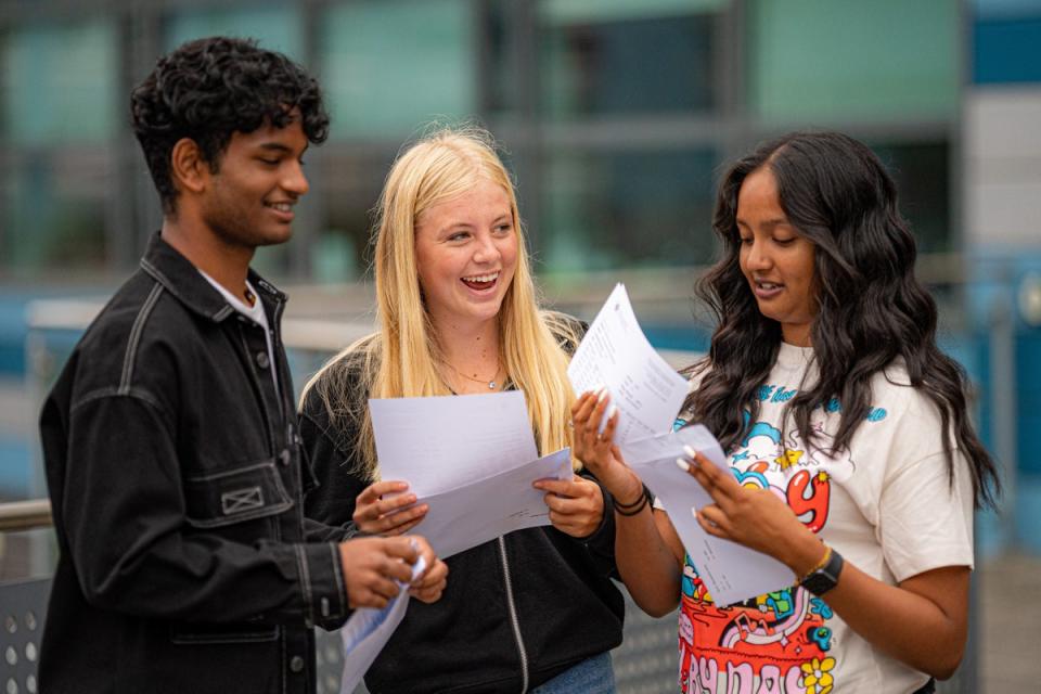 Dominic Sebastian, 16, (left) celebrates with fellow students after opening his results at St Mary Redcliffe and Temple School in Bristol (Ben Birchall/PA) (PA Wire)