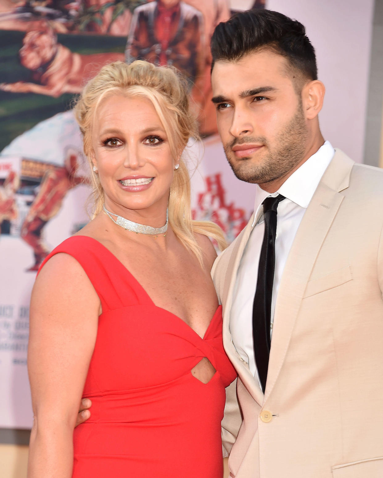 HOLLYWOOD, CA - JULY 22: Britney Spears (L) and Sam Asghari attend the Sony Pictures' "Once Upon A Time...In Hollywood" Los Angeles Premiere at the TCL Chinese Theatre on July 22, 2019 in Hollywood, California.