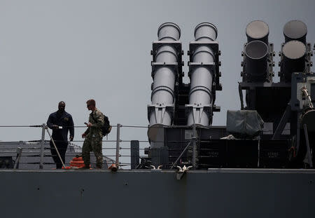 U.S. Navy personnel are seen on board guided-missile destroyer USS John S. McCain after a collision, in Singapore waters August 21, 2017. REUTERS/Ahmad Masood