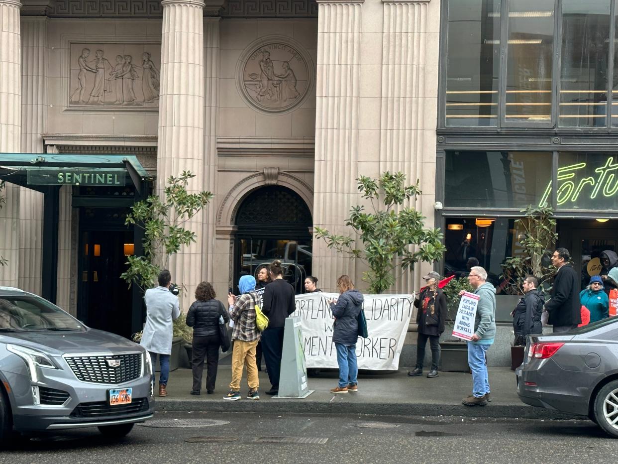 A protest against Adidas moved outside after disrupting an event inside Portland's Sentinal Hotel.