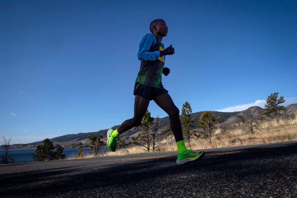 Dominic Korir makes his way up Centennial Drive during the Horsetooth Half Marathon in Fort Collins, Colorado on Sunday.