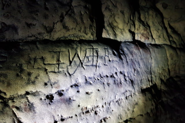 UK's largest collection of witches' marks discovered in caves