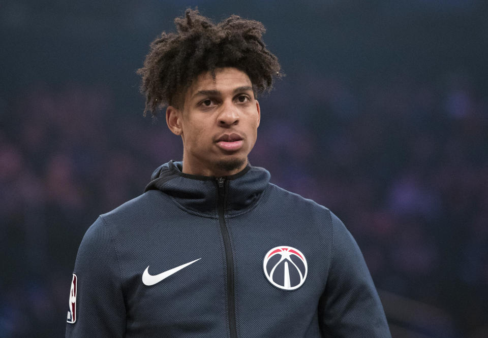 FILE - In this Sunday, April 7, 2019, file photo, Washington Wizards forward Devin Robinson warms up before an NBA basketball game against the New York Knicks at Madison Square Garden in New York. Police said Saturday, April 13, 2019, Philadelphia Eagles cornerback Jalen Mills and Washington Wizards forward Devin Robinson were arrested after a fight near a club in Washington. (AP Photo/Mary Altaffer, File)