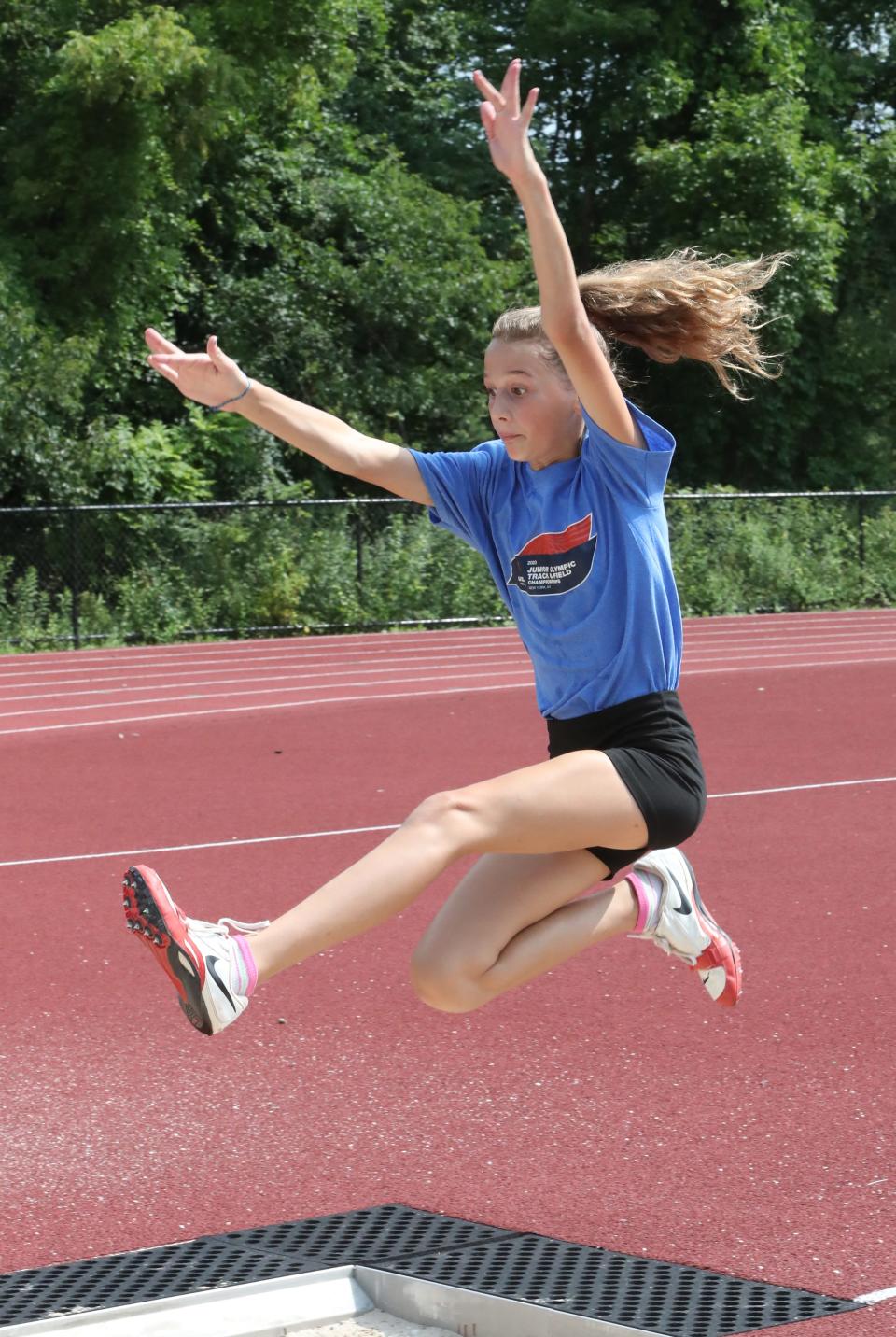 Long jumper Sunny Prinz, 10, of New City practices at Clarkstown South High School July 20, 2023. She will be competing in the national Junior Olympics.