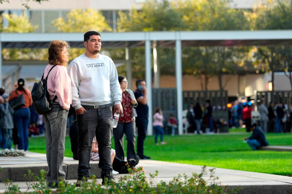 PHOTO: People wait outside of Lakewood Church on Feb. 11, 2024, in Houston, after a reported shooting during a Spanish church service.  (Karen Warren/Houston Chronicle via Getty Images)