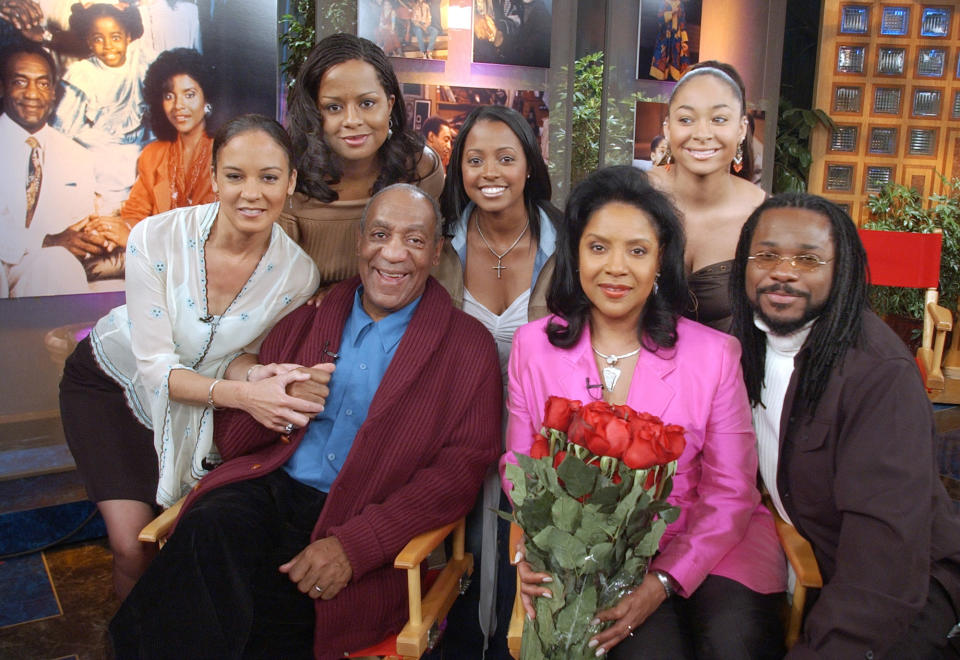 FILE - In this Thursday, May 2, 2002 file photo, members of Bill Cosby's television family, the Huxtables, gather in NBC's Today show studio for an interview with co-host Katie Couric, in New York. From left are Sabrina Le Beauf, Tempest Bledsoe, Cosby, Keshia Knight Pulliam, Phylicia Rashad, Raven Symone and Malcolm-Jamal Warner. Cosby is facing the start of a sentencing hearing on Monday, Sept. 24, 2018, at which a judge will decide how to punish the 81-year-old comedian who was convicted in April of drugging and sexually assaulting former Temple University athletics employee Andrea Constand at his suburban Philadelphia home in 2004. (AP Photo/Richard Drew, File)