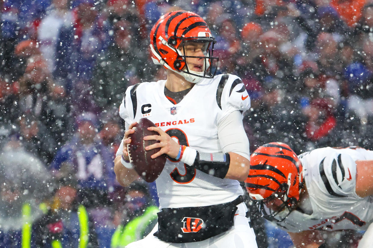 ORCHARD PARK, NEW YORK - JANUARY 22: Joe Burrow #9 of the Cincinnati Bengals looks to pass against the Buffalo Bills during the second half in the AFC Divisional Playoff game at Highmark Stadium on January 22, 2023 in Orchard Park, New York. (Photo by Timothy T Ludwig/Getty Images)