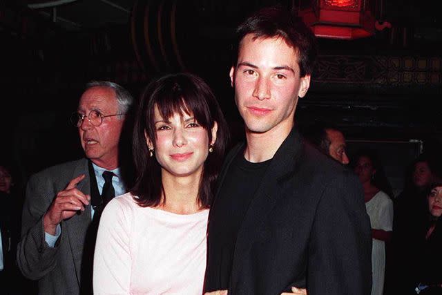 <p>David Keeler/Getty</p> Sandra Bullock and Keanu Reeves in 1994