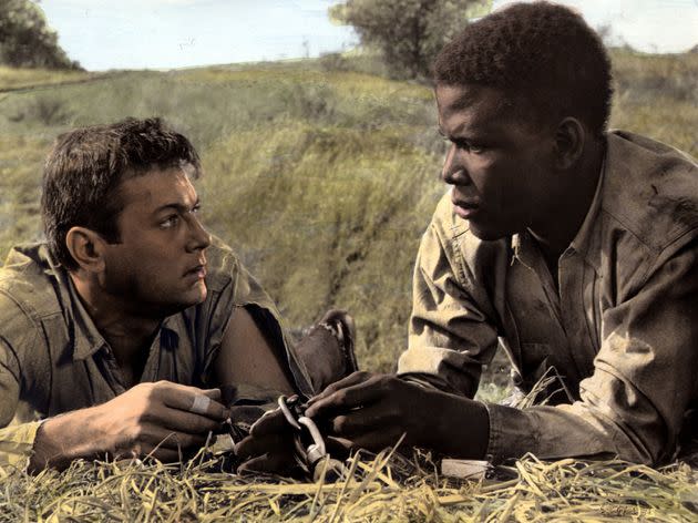 Sidney Pitier (right) in 1958 film “The Defiant Ones,” alongside actor Tony Curtis (left). (Photo: Photo by Film Publicity Archive/United Archives via Getty Images)